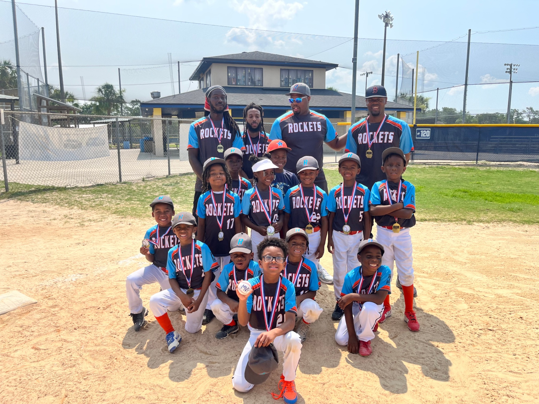 Rockets team with medals and MVP ball